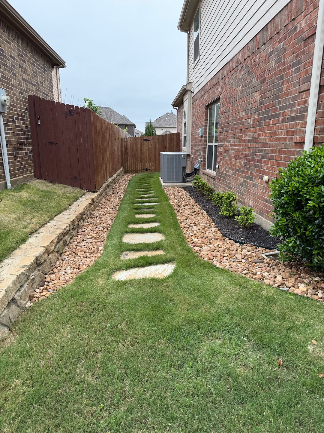 Fort Worth Side Yard Transformation: Low-Maintenance Stone Walkway & Rock Bed Installation